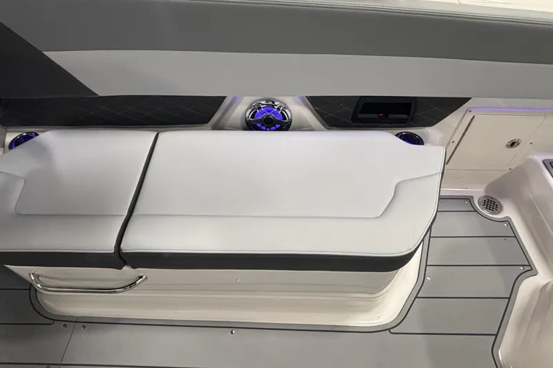Slide: The Image of 2026 Chaparral SSX 30 boat interior with cushioned seating and modern design elements. - 38