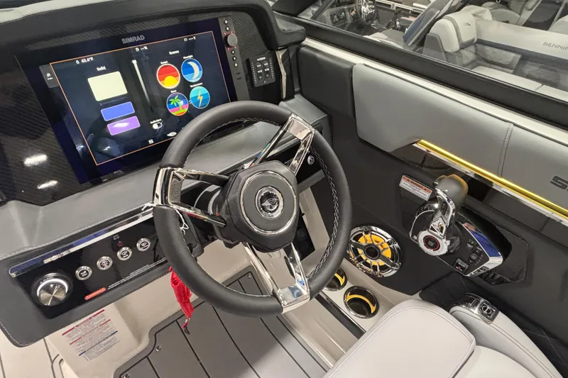 Slide: The Image of 2026 Chaparral SSX 30 boat dashboard with steering wheel and advanced control panel. - 39