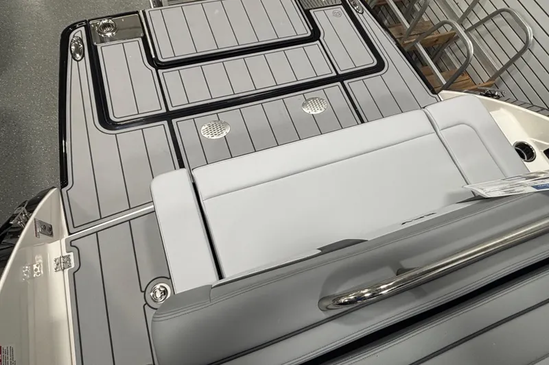 Slide: The Image of 2026 Chaparral SSX 30 boat deck with sleek gray design and stainless steel accents. - 44