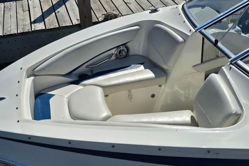 Slide: The Image of 2008 Larson Senza 186 boat interior with white seating and sleek design. - 11
