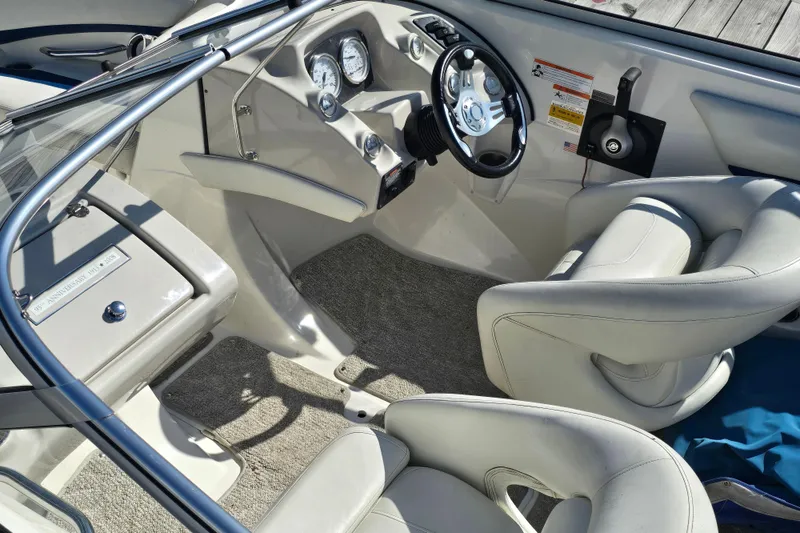 Slide: The Image of Interior of 2008 Larson Senza 186 boat with steering wheel and gauges. - 12