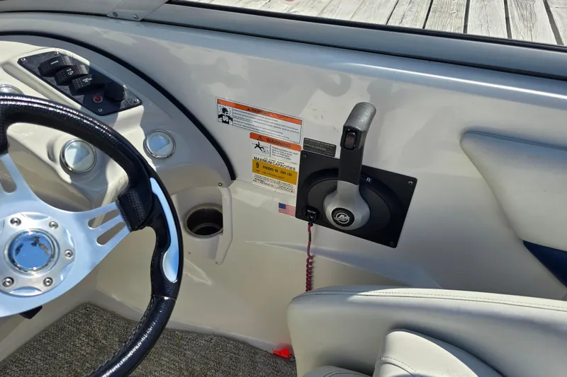 Slide: The Image of Interior of 2008 Larson Senza 186 boat showing steering wheel and control panel. - 18