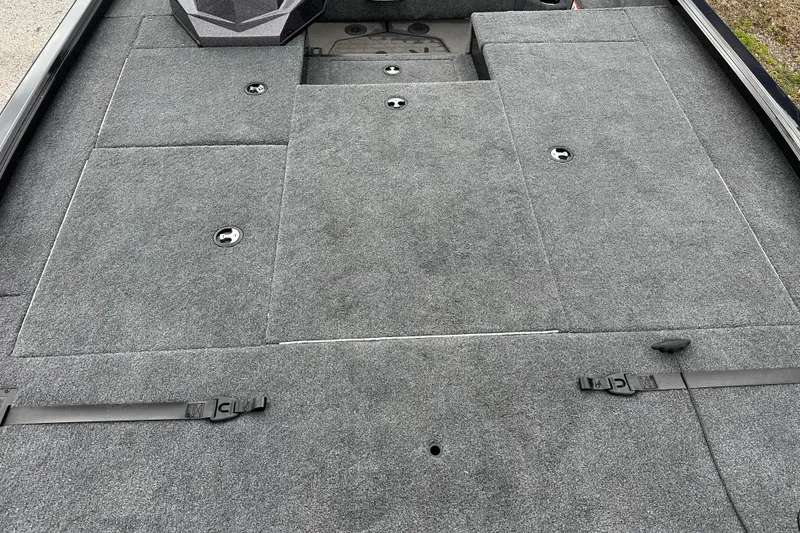 Slide: The Image of 2026 Ranger ALPHA 208 boat deck with gray carpet and storage compartments. - 12