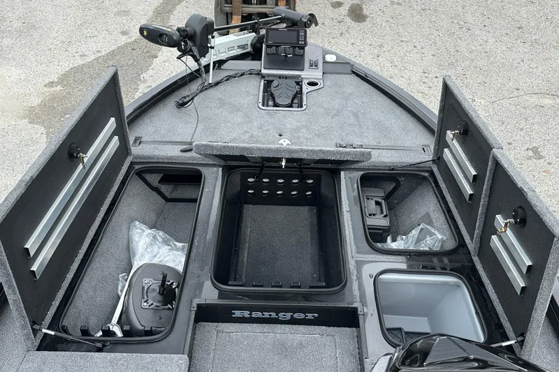 Slide: The Image of 2026 Ranger ALPHA 208 boat interior with storage compartments and control panel. - 15
