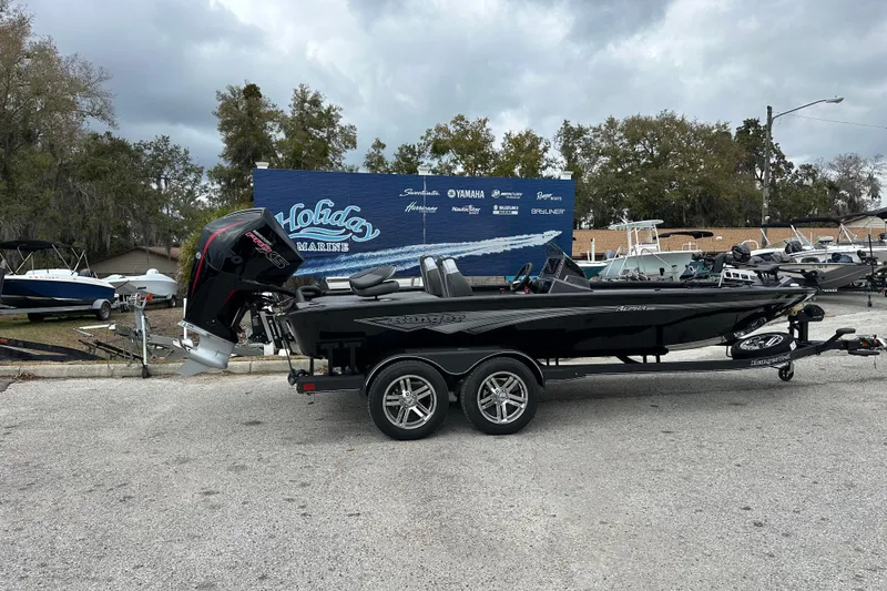 Slide: The Image of 2026 Ranger ALPHA 208 boat on trailer at Holiday Marine dealership. - 3
