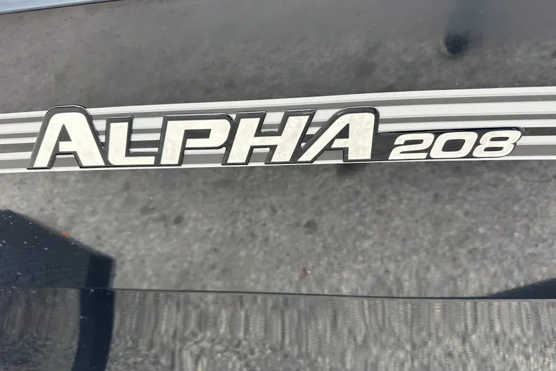 Slide: The Image of Ranger ALPHA 208 emblem on vehicle, 2026 model, close-up view. - 4