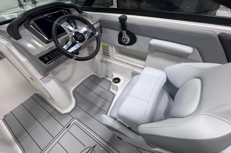 Slide: The Image of 2026 Chaparral 23 SSi boat interior with modern steering and seating. - 18