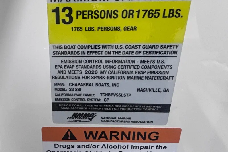 Slide: The Image of 2026 Chaparral 23 SSi boat capacity label, 13 persons or 1765 lbs, safety compliance. - 19