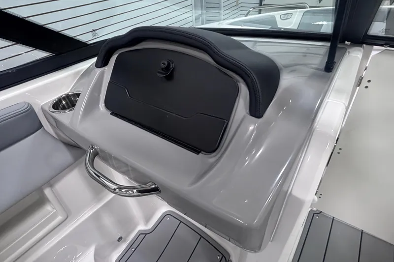Slide: The Image of 2026 Chaparral 23 SSi boat interior with sleek dashboard and cup holder. - 22