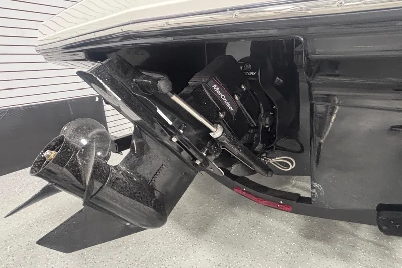 Slide: The Image of 2026 Chaparral 23 SSi boat with MerCruiser engine and propeller detail. - 9