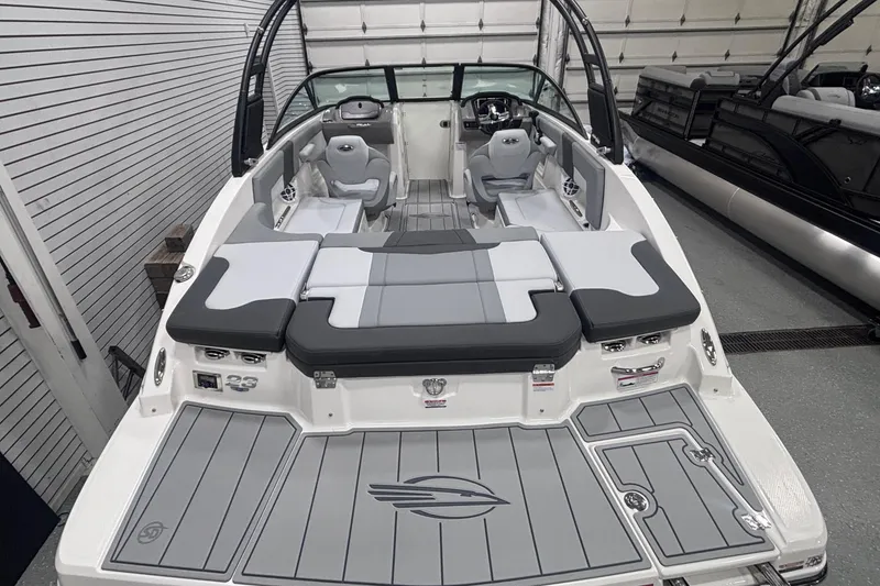 Slide: The Image of 2026 Chaparral 23 SSi boat interior with sleek seating and modern design. - 11