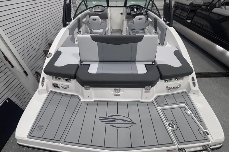 Slide: The Image of 2026 Chaparral 23 SSi boat interior with gray seating and deck, showcasing modern design. - 12