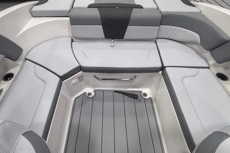 Slide: The Image of 2026 Chaparral 23 SSi boat interior with gray cushioned seating and sleek design. - 14