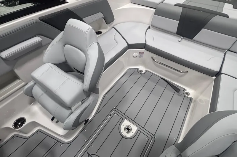 Slide: The Image of 2026 Chaparral 23 SSi boat interior with sleek gray seating and modern design. - 15