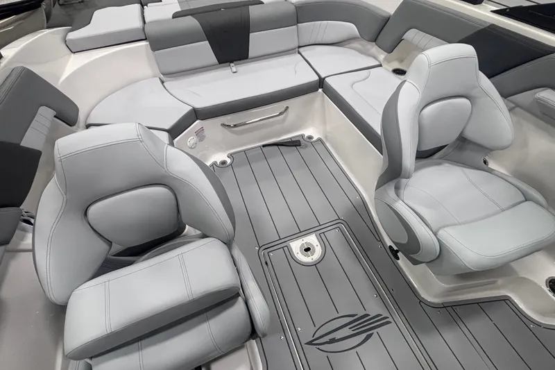 Slide: The Image of 2026 Chaparral 23 SSi boat interior with sleek gray seating and modern design. - 16