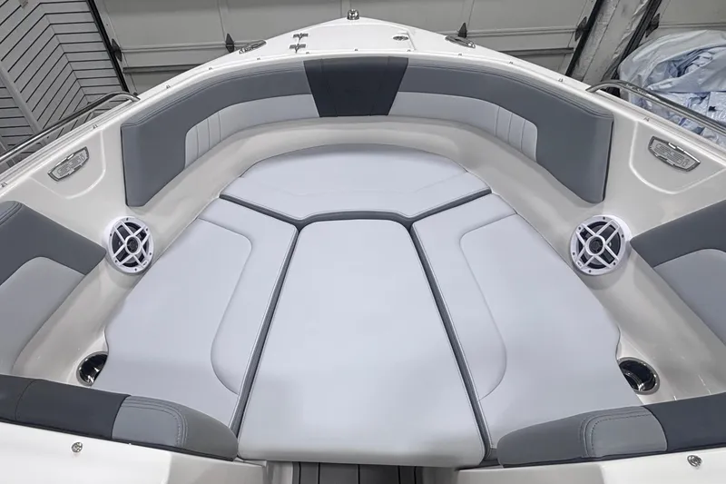 Slide: The Image of 2026 Chaparral 23 SSi boat interior with gray seating and speakers. - 20