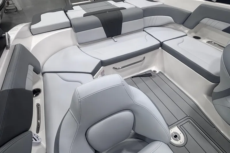 Slide: The Image of 2026 Chaparral 23 SSi boat interior with sleek gray seating and modern design. - 23