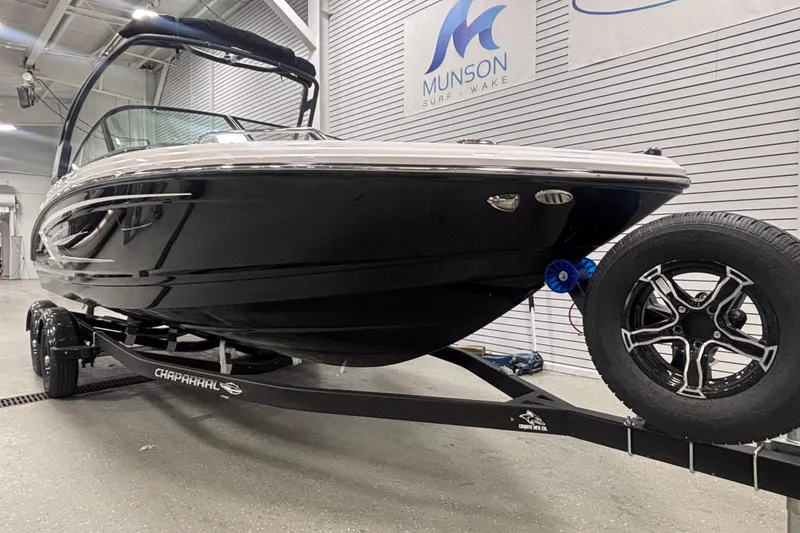Slide: The Image of 2026 Chaparral 23 SSi boat on trailer in showroom, Munson Surf Wake. - 4