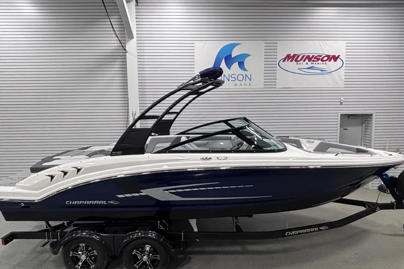 The Image of 2026 Chaparral 23 SSi boat displayed indoors at Munson Ski & Marine showroom. - 0