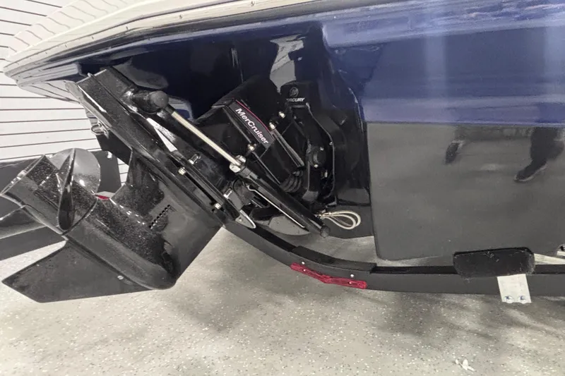 Slide: The Image of 2026 Chaparral 23 SSi boat with MerCruiser engine, detailed view of the stern drive. - 11