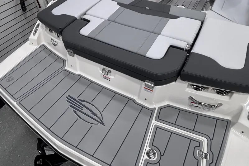Slide: The Image of 2026 Chaparral 23 SSi boat with sleek gray deck and cushioned seating. - 24