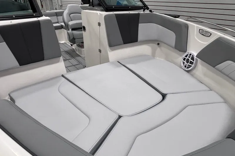 Slide: The Image of 2026 Chaparral 23 SSi boat interior with gray seating and modern design. - 25
