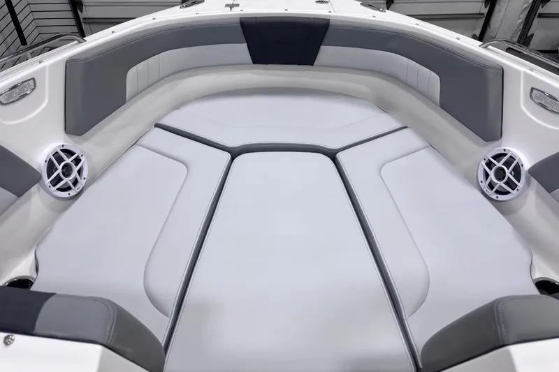 Slide: The Image of 2026 Chaparral 23 SSi boat interior with gray seating and built-in speakers. - 14