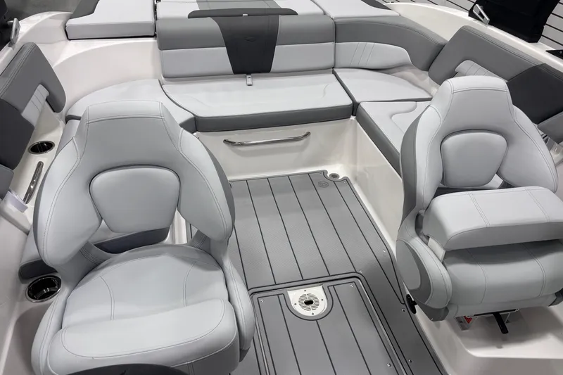 Slide: The Image of 2026 Chaparral 23 SSi boat interior with sleek gray seating and modern design. - 19