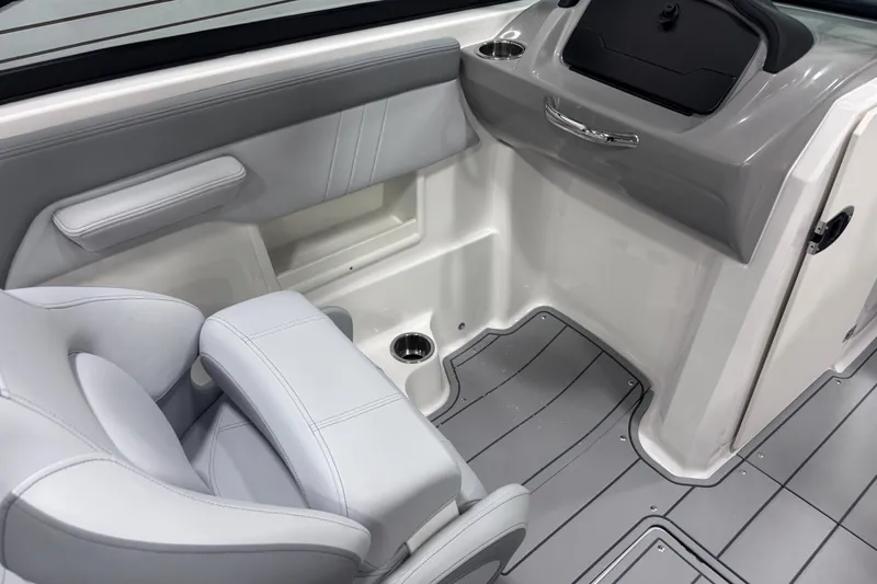 Slide: The Image of 2026 Chaparral 23 SSi boat interior with sleek seating and modern dashboard design. - 20