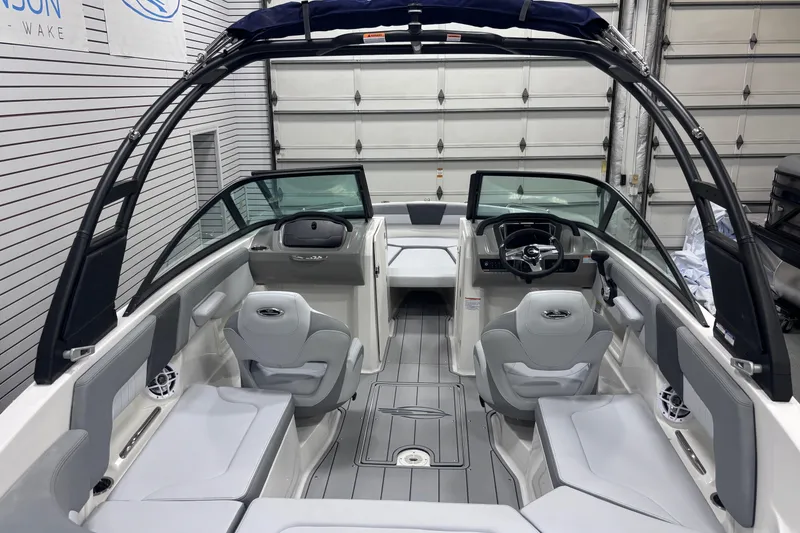 Slide: The Image of 2026 Chaparral 23 SSi boat interior with sleek seating and modern dashboard design. - 23