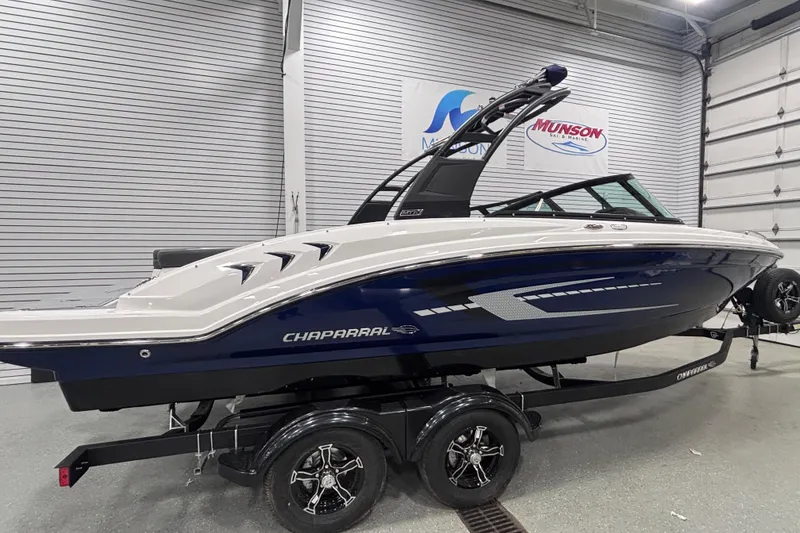 Slide: The Image of 2026 Chaparral 23 SSi boat on trailer in showroom, side view. - 4