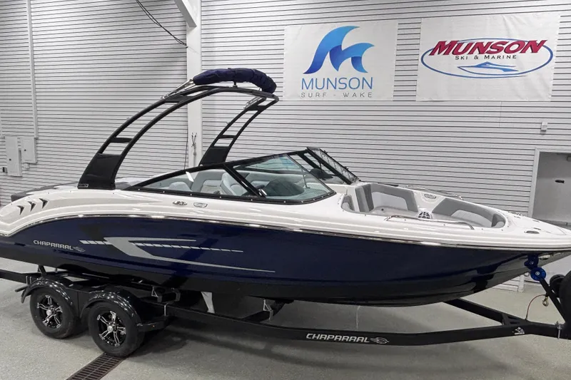 Slide: The Image of 2026 Chaparral 23 SSi boat displayed at Munson Ski & Marine showroom. - 7