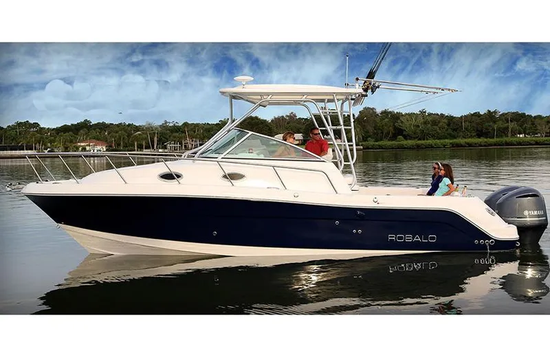 Slide: The Image of Manufacturer Provided Image: 2015 Robalo R305 Walkaround boat on calm water with passengers. - 1