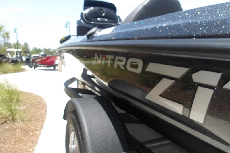 Slide: The Image of 2026 Nitro Z17 boat on trailer, outdoor setting, close-up view. - 13