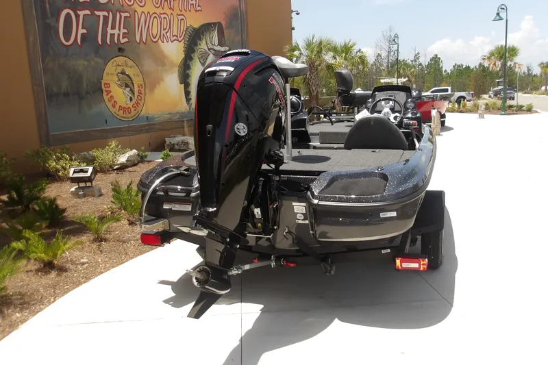 Slide: The Image of 2026 Nitro Z17 boat with powerful outboard motor, parked outside Bass Pro Shops. - 15