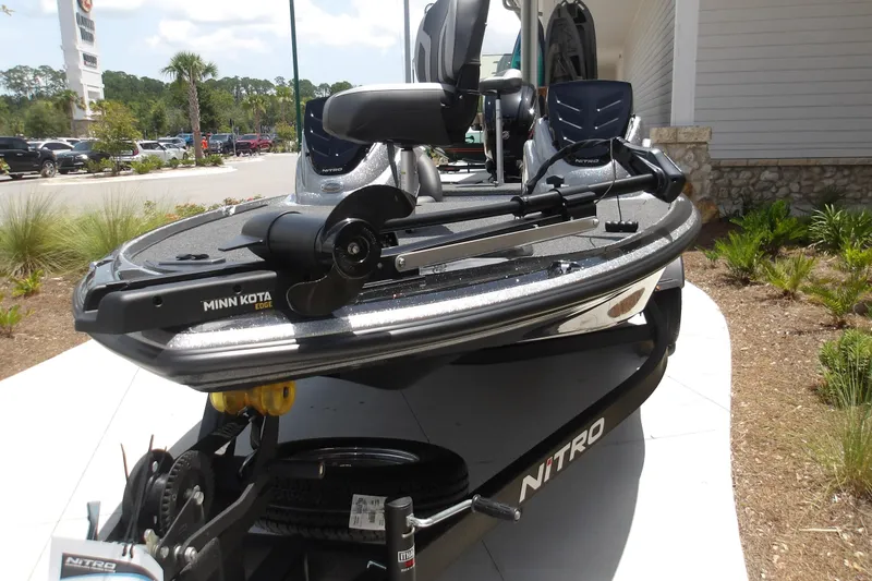 Slide: The Image of 2026 Nitro Z17 boat with Minn Kota Edge motor displayed outdoors. - 2