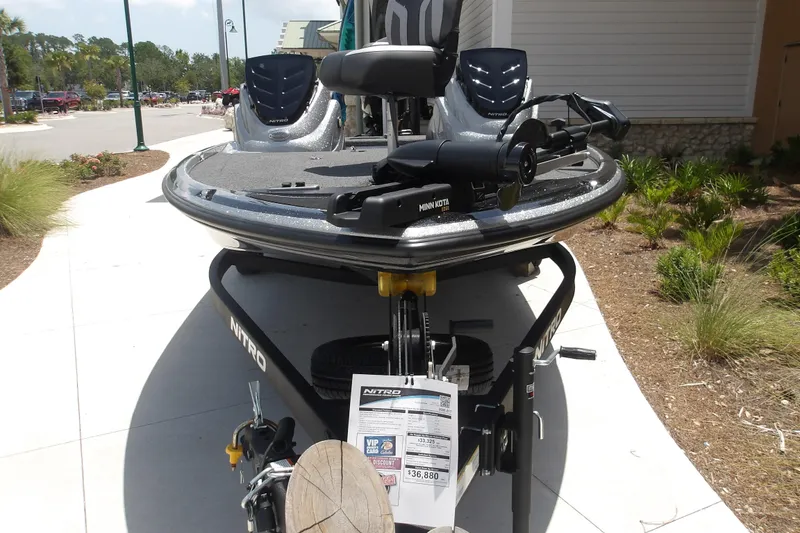 The Image of Nitro Z17 2026 boat on display with Minn Kota motor, outdoor setting. - 1
