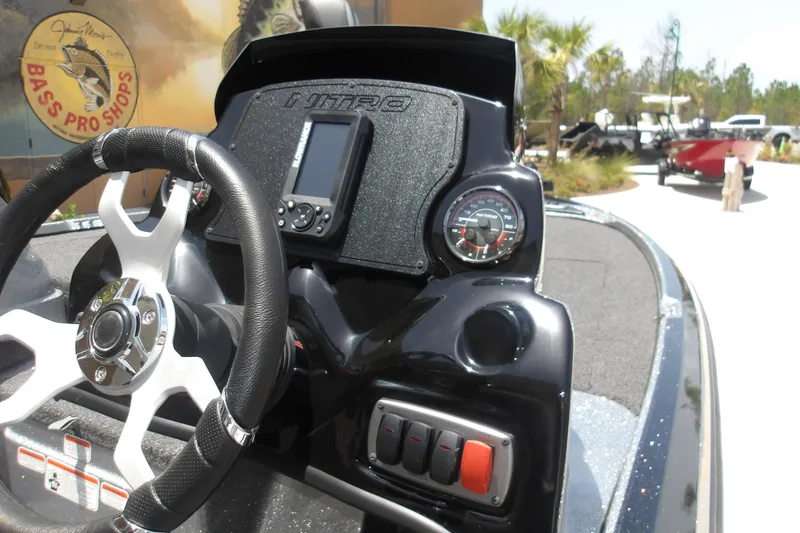 Slide: The Image of Steering console of a 2026 Nitro Z17 boat with gauges and controls. - 16