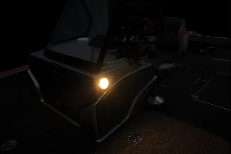 Slide: The Image of Interior view of 2026 Nitro ZV20 Sport Pro boat, featuring rod holders and storage compartments. - 33