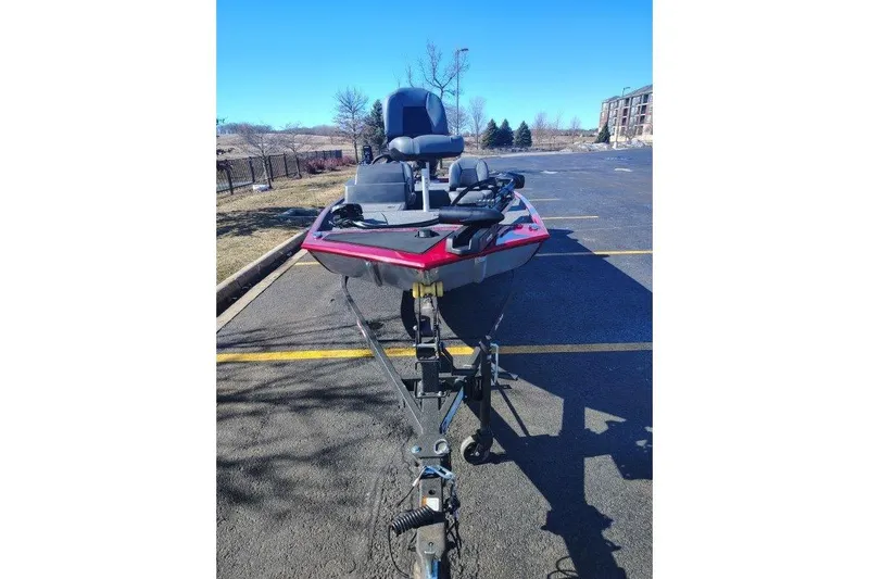 Slide: The Image of 2026 Tracker Bass Tracker Classic XL boat on trailer in parking lot. - 2