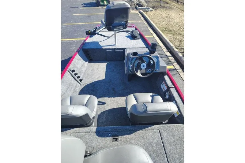 Slide: The Image of 2026 Tracker Bass Tracker Classic XL boat interior with steering wheel and seating. - 3