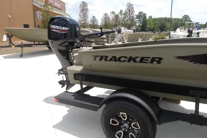 Slide: The Image of 2026 Tracker Grizzly 1650 T Prairie Wings Edition boat on trailer with Mercury engine. - 5