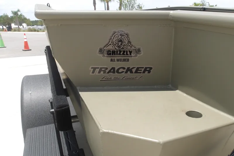 Slide: The Image of 2026 Tracker Grizzly 1650 T Prairie Wings Edition boat with logo and branding. - 10
