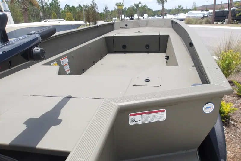 Slide: The Image of 2026 Tracker Grizzly 1650 T Prairie Wings Edition boat, spacious interior, outdoor setting. - 8