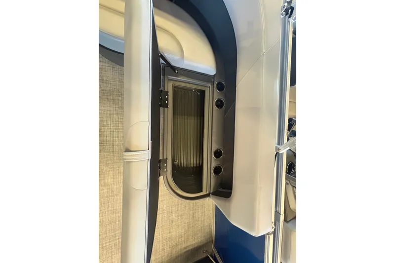Slide: The Image of 2026 Sun Tracker Party Barge 16 DLX interior detail with storage compartment. - 78