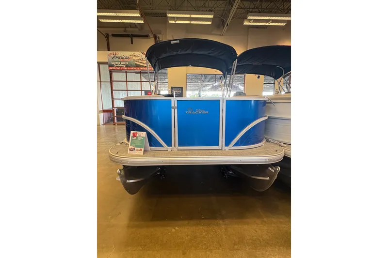 Slide: The Image of 2026 Sun Tracker Party Barge 16 DLX pontoon boat in showroom display. - 67