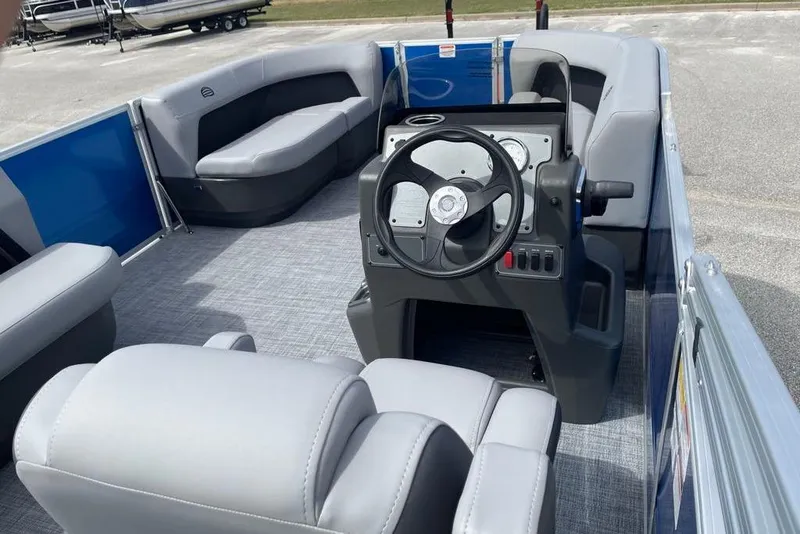 Slide: The Image of 2026 Sun Tracker Party Barge 16 DLX interior with steering console and seating. - 6