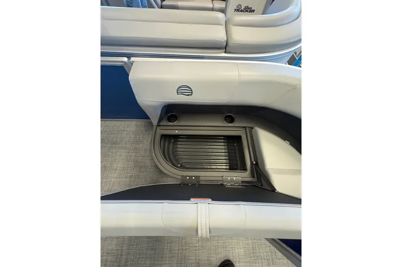 Slide: The Image of 2026 Sun Tracker Party Barge 16 DLX interior storage compartment with seating. - 76