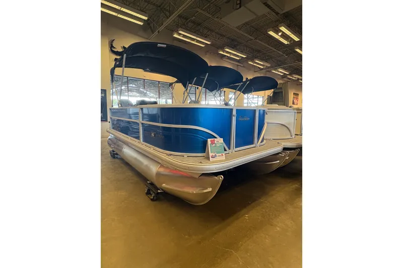 Slide: The Image of 2026 Sun Tracker Party Barge 16 DLX pontoon boat displayed indoors. - 68