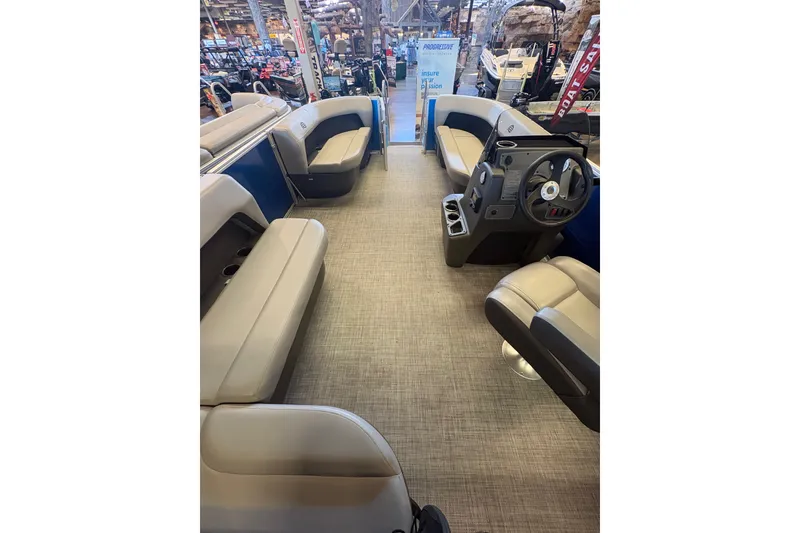 Slide: The Image of 2026 Sun Tracker Party Barge 16 DLX interior with spacious seating and modern helm. - 71